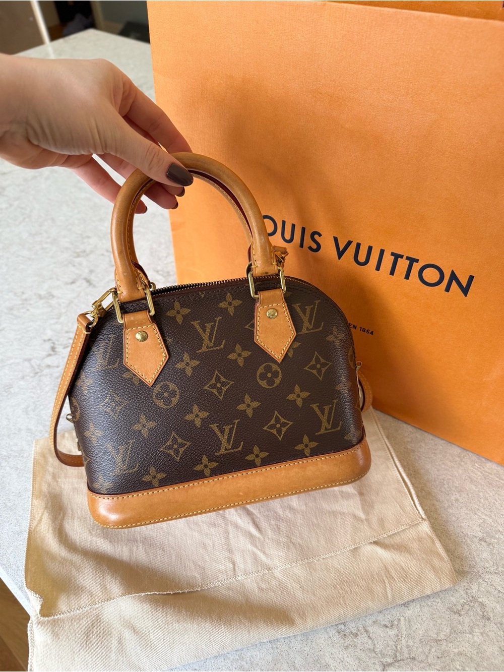 Louis Vuitton Monogram Alma BB in Brown and Tan